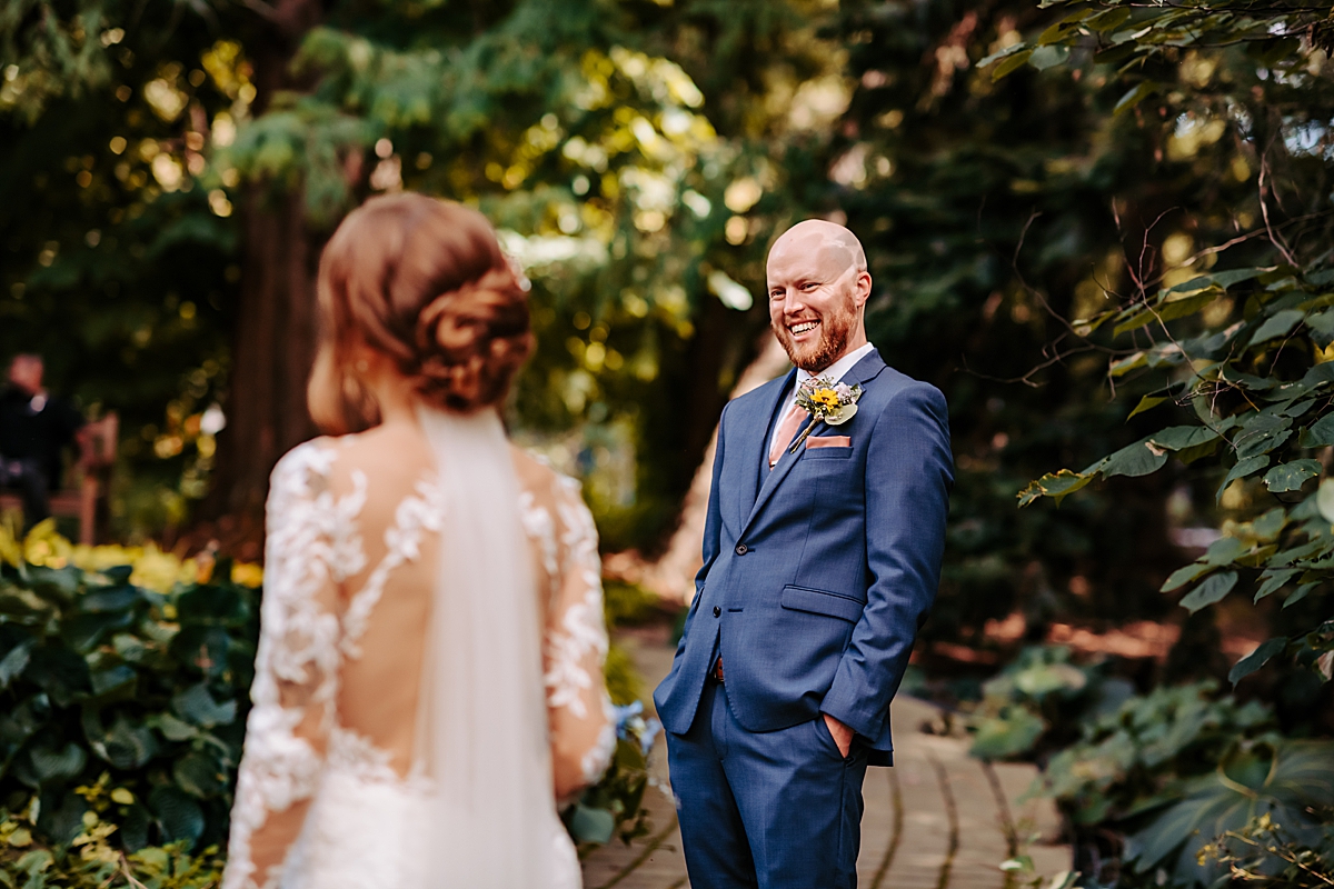 groom seeing bride for the first time on wedding day