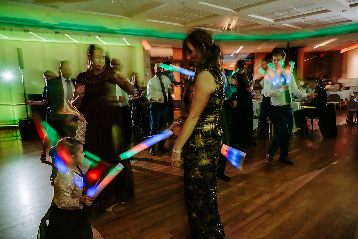 glow sticks on dance floor at wedding reception