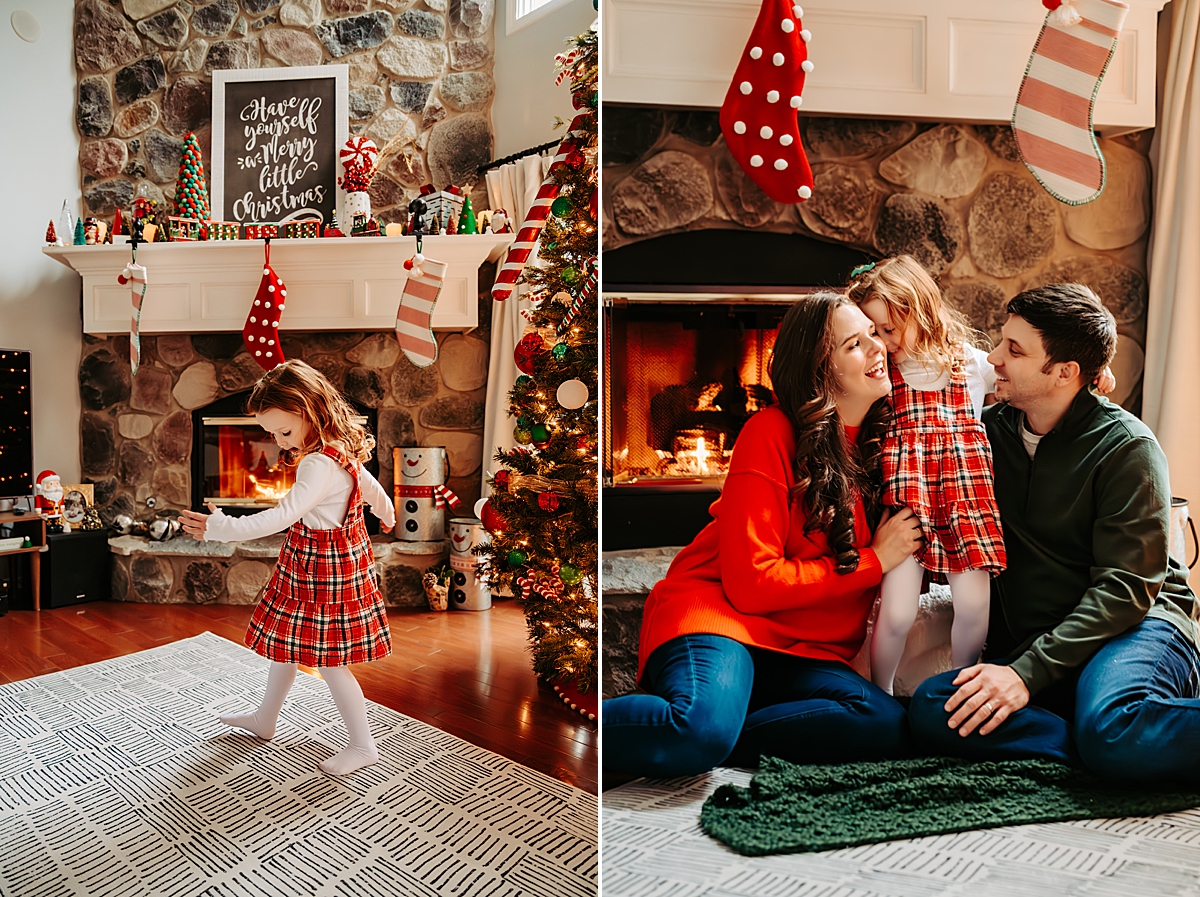 young girl in plaid dress twirling in front of crackling fireplace