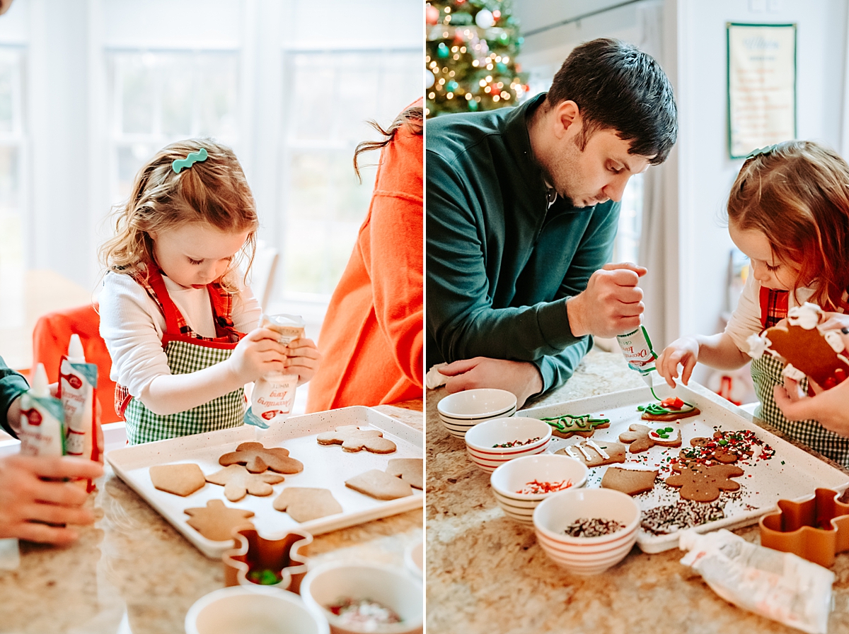 family decorating gingerbread cookies in kitchen