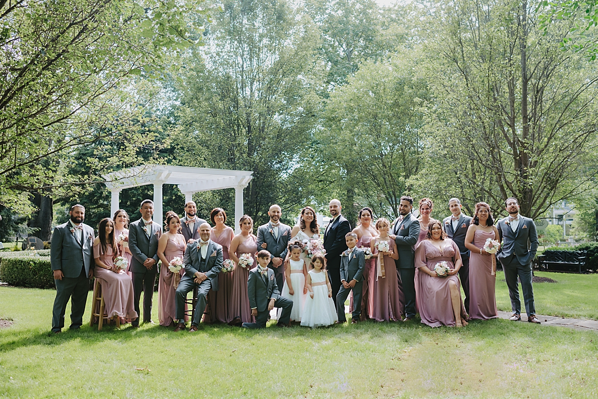 large bridal party portrait at Poland Town Hall