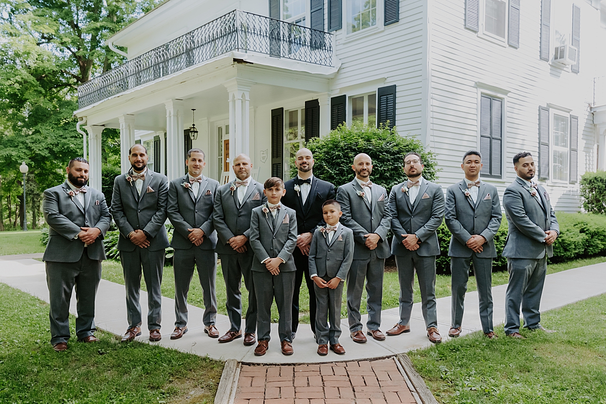 groom and groomsmen wearing grey suits at Poland Town Hall