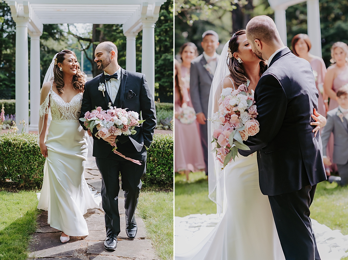 bride and groom walking and smiling in manicured garden