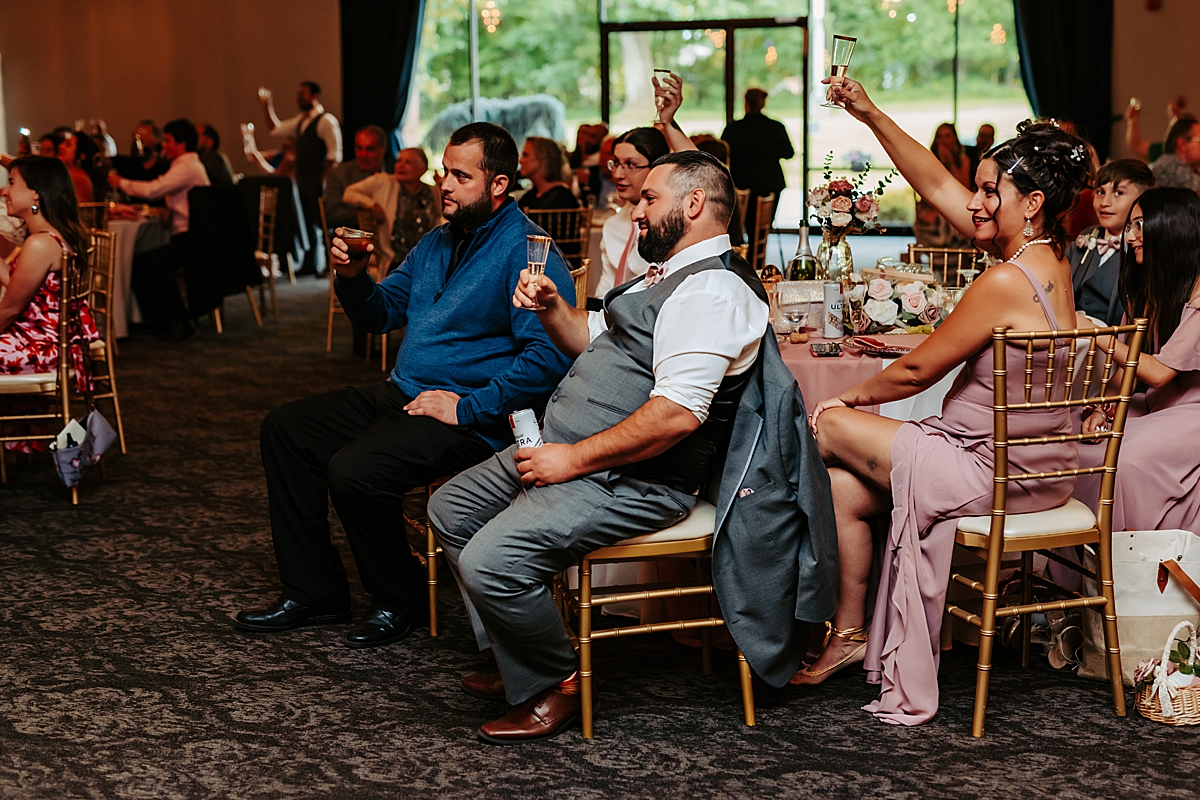 wedding guests at The Maronite Center raising glasses in a toast