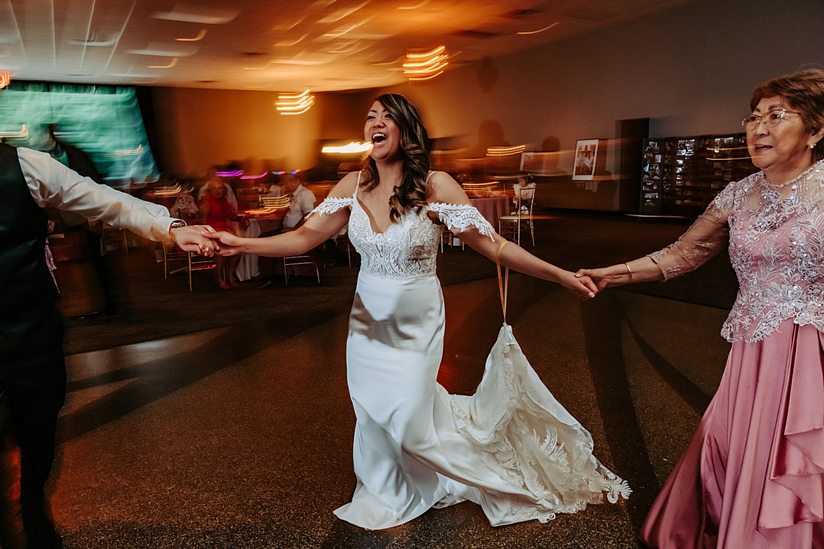 bride laughing and dancing