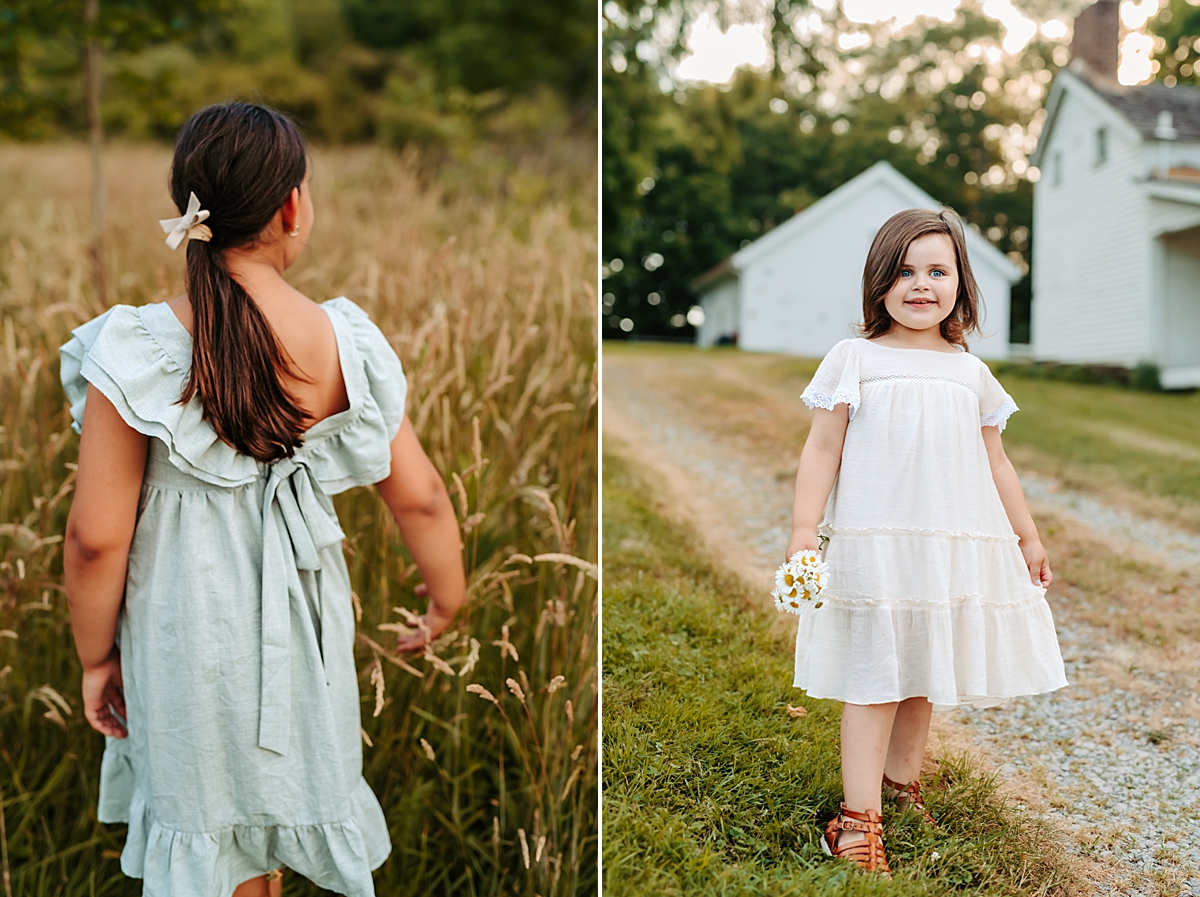 Split image of two young girls enjoying summer in outdoor settings. The left image shows a girl with her back turned, wearing a light blue dress with a bow; she stands in a field of tall grass. The right image shows a girl in a white dress holding flowers, smiling near a white house.