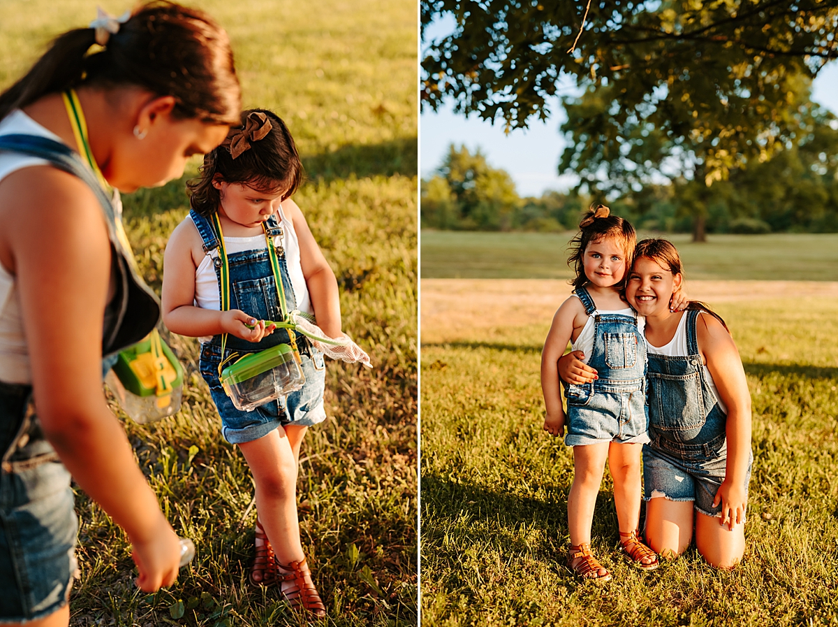 Left side: Two children wearing denim overalls explore the grass on a sunny summer day, one holding a small container. Right side: big sister kneeling on the grass smiles and embraces her younger sister, both dressed in matching denim overalls. It's a perfect day in a large, grassy field.