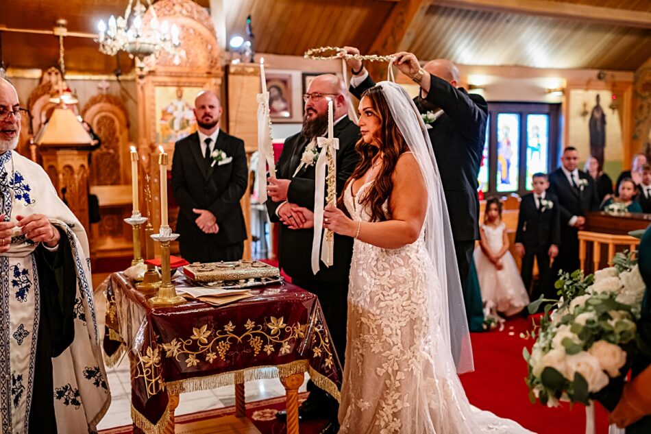 bride and groom at the altar of Archangel Michael Greek Orthodox Church