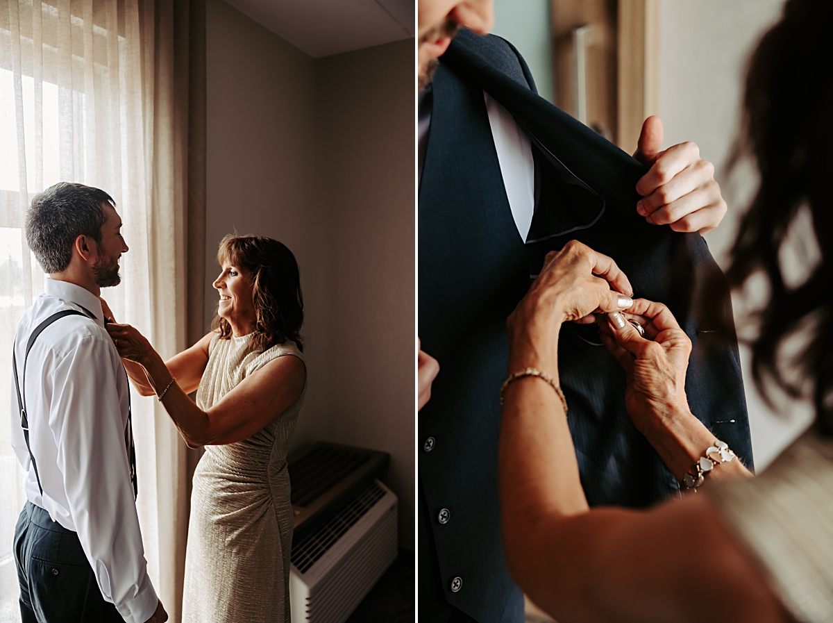 mother of the groom helping him get dressed for wedding
