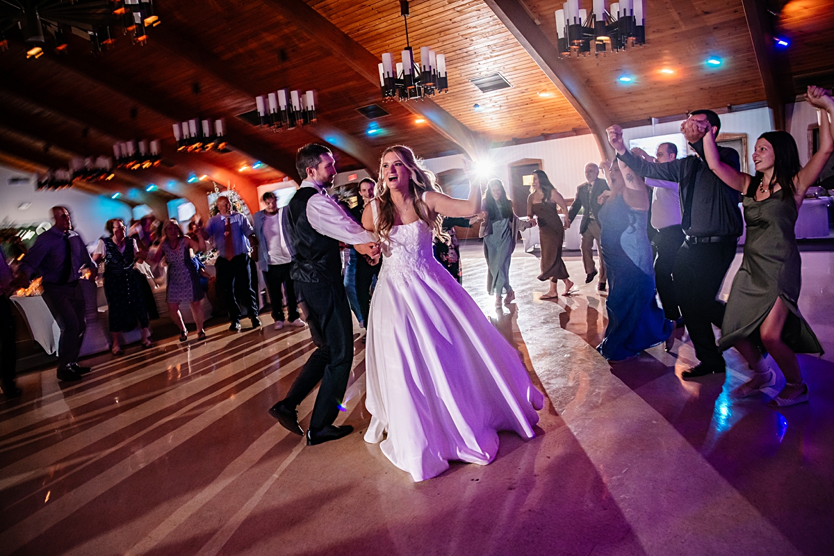 guests dancing on the dance floor at wedding reception